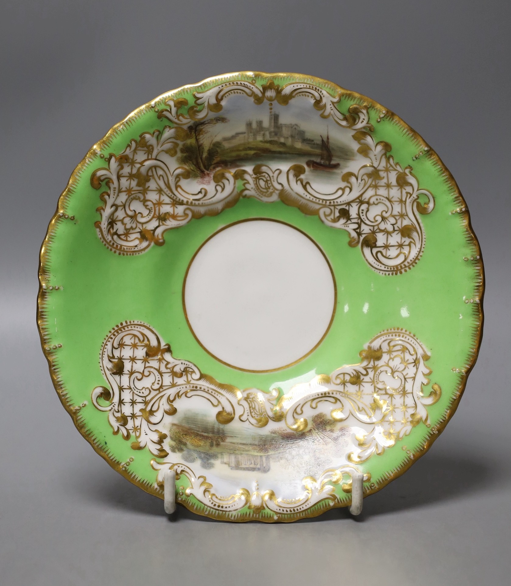 Copeland and Garrett fine topographical pedestal coffee cup and saucer with green ground painted with Sion House on the cup and Lincoln and Malsbury Abbey on the saucer c. 1840